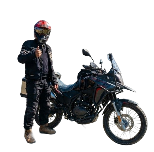 Sarim standing with his adventure motorcycle, Bagheera